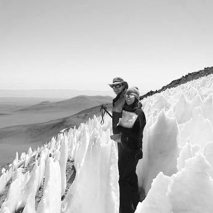 Researchers standing among penitentes in the Chilean Andes.